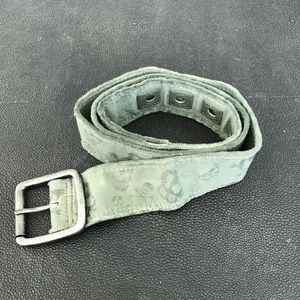 Green belt with black skull graphics